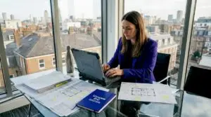 Assessor entering energy data in London office