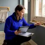 Energy assessor inspecting home for EPC