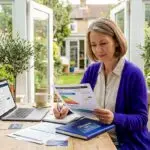 Tenant reading energy certificate at home