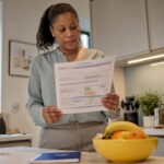 Woman reviewing EPC certificate in London flat