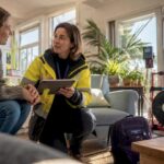 Home energy assessor explaining results to homeowner