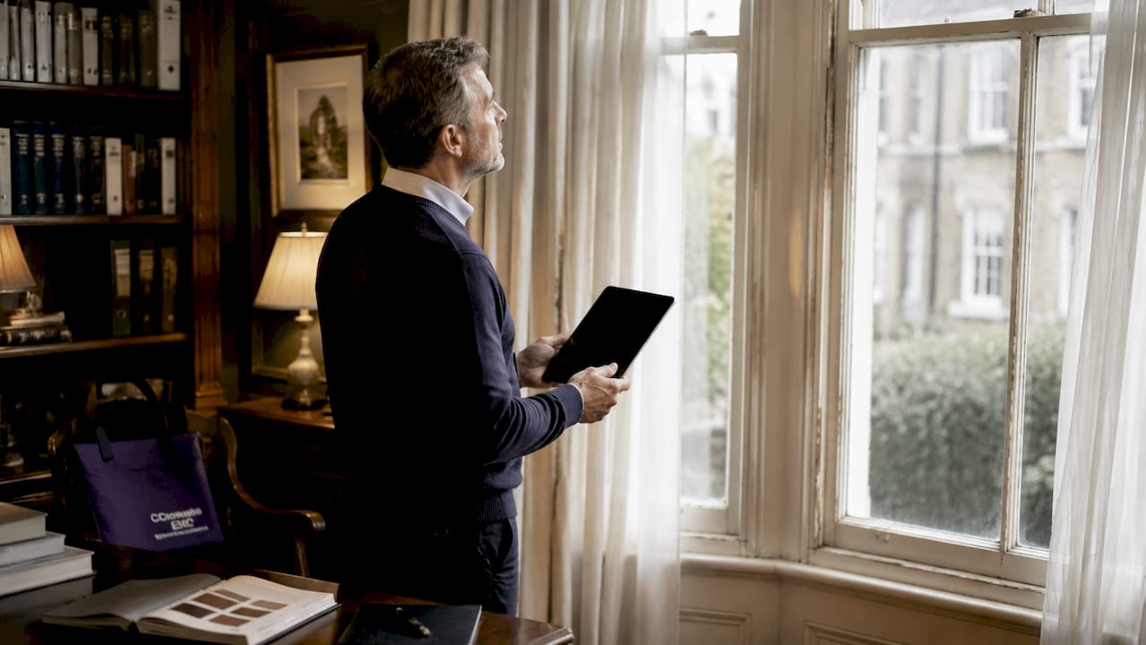 Energy consultant inspecting insulation at London property