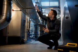 Assessor inspecting commercial building systems