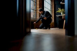 EPC assessor surveying rental property interior
