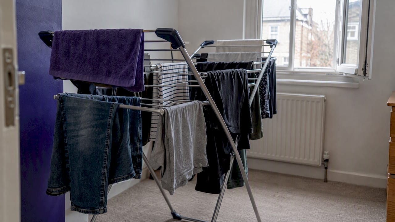 Laundry drying on an indoor clothes airer