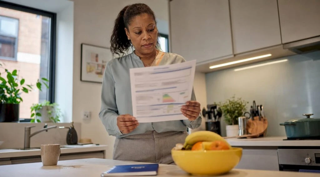 Woman reviewing EPC certificate in London flat