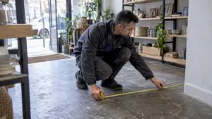 Assessor measuring a London commercial unit