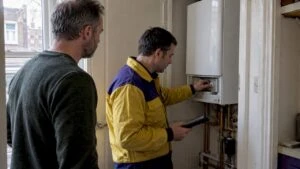 Assessor inspecting a rental property's boiler
